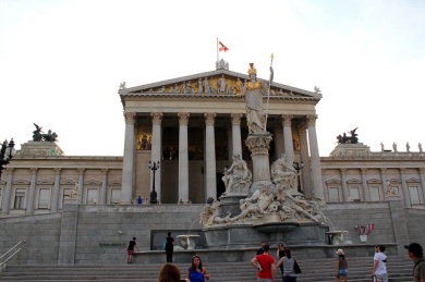 The Neo classical facade of the Parliament flanked by the Athena fountain. 